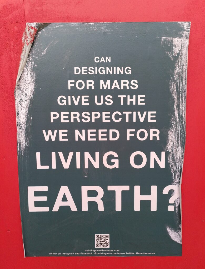 A poster reading 'CAN DESIGNING FOR MARS GIVE US THE PERSPECTIVE WE NEED FOR LIVING ON EARTH?'