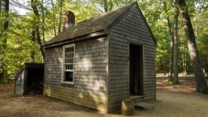 A photograph of a replica of Thoreau's cabin near Walden pond